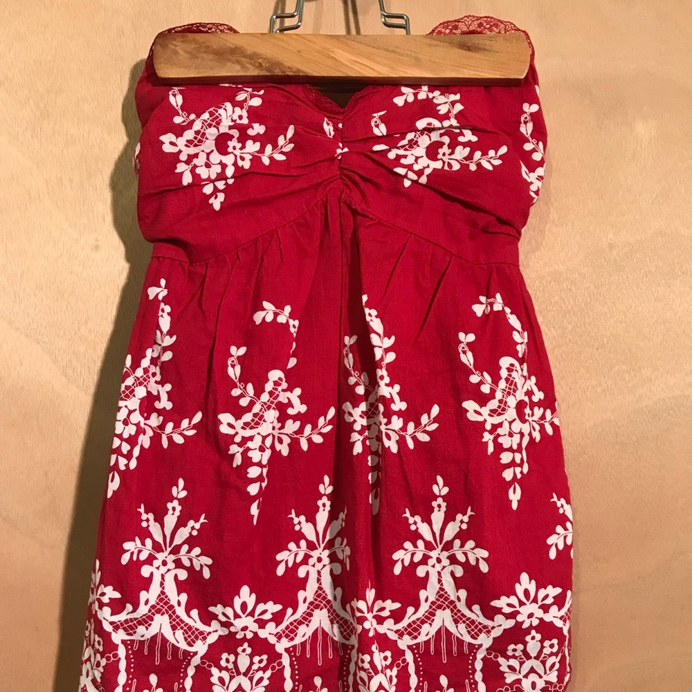 red floral sleeveless shirt